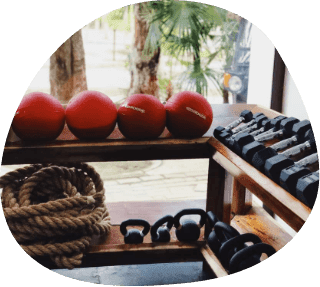 Tulum Strength Club gym dumbbells and rope balls